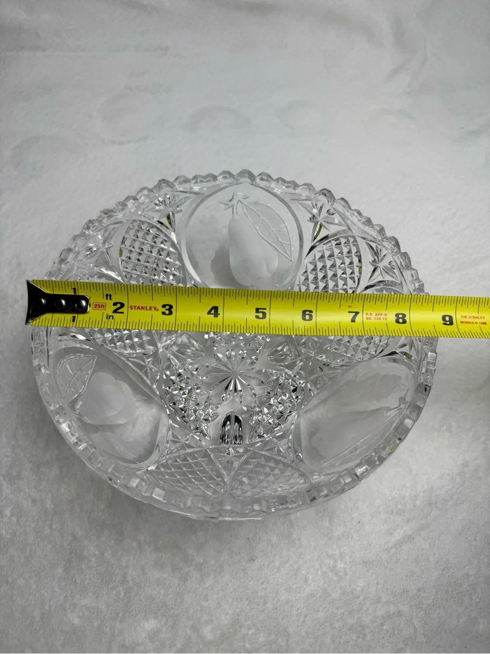 This vintage crystal cut and pressed pear and grape etched footed bowl 8.5”